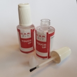 Bottle for paint with a brush